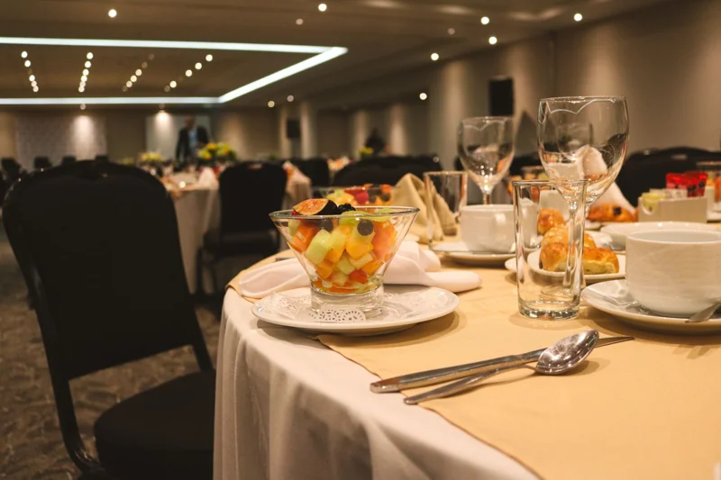 Illustrative photograph of a formal dinner table setting.