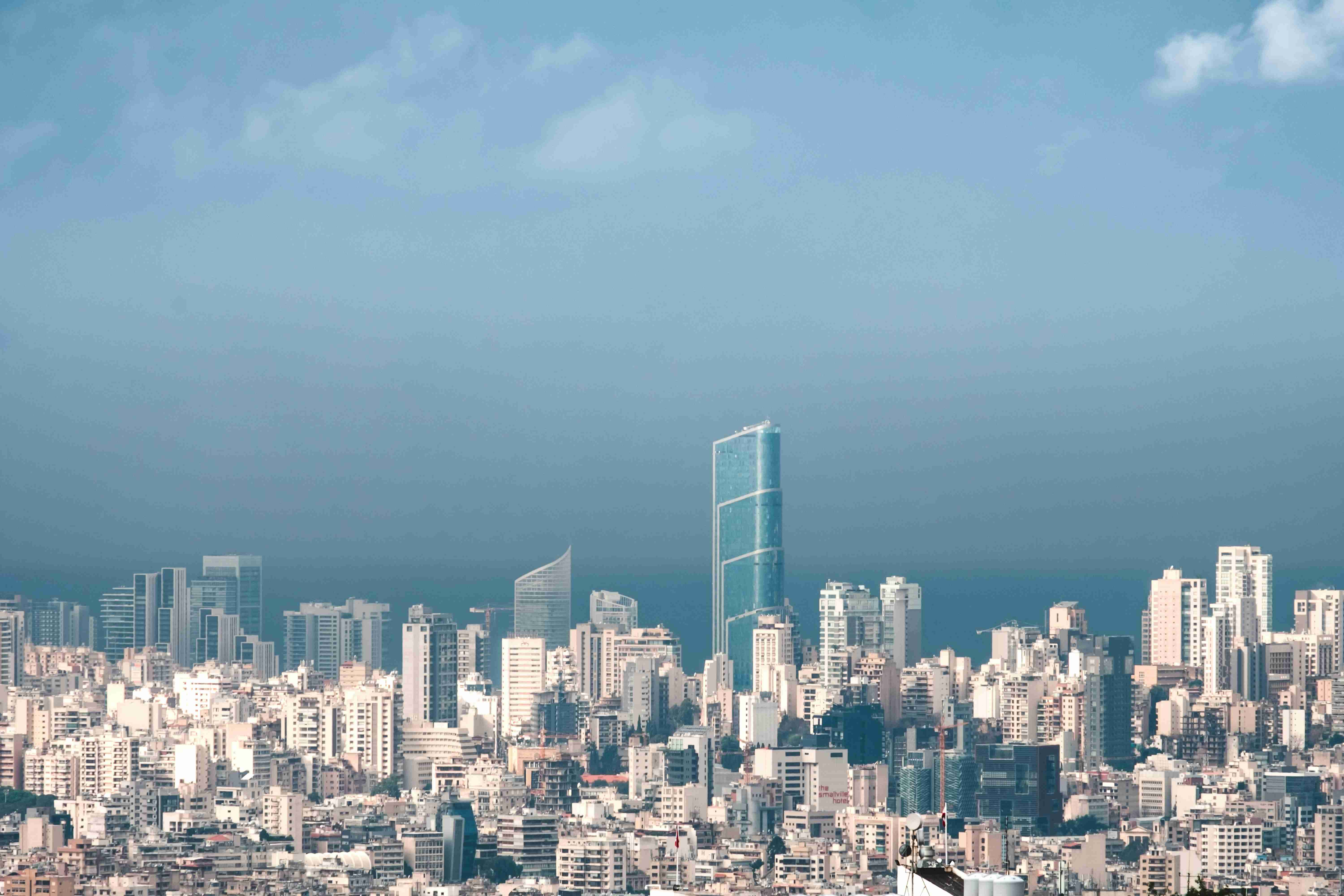 An aerial view of a dense city skyline — Real Estate