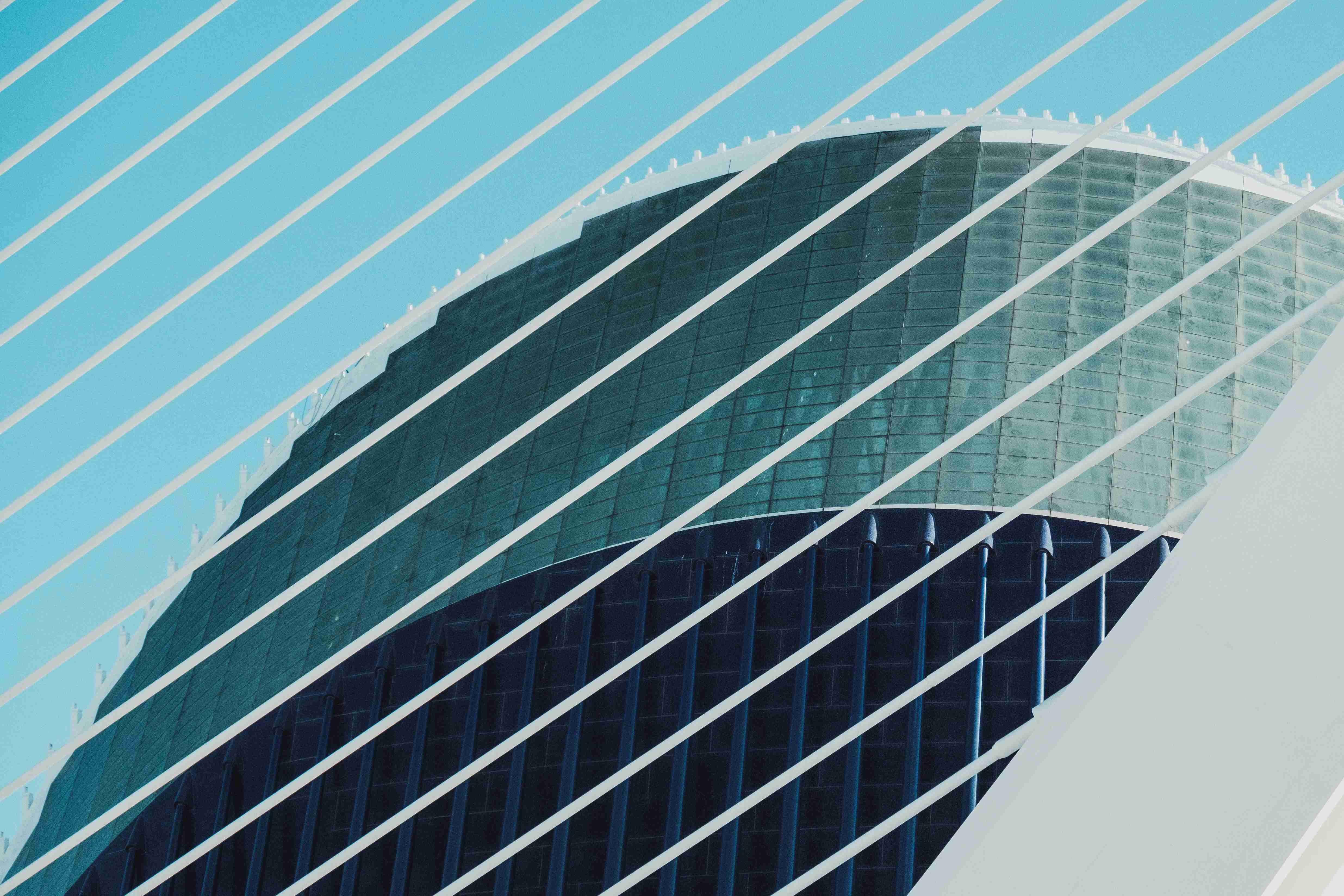 The glass facade of a modern office tower — Sustainability & Technology