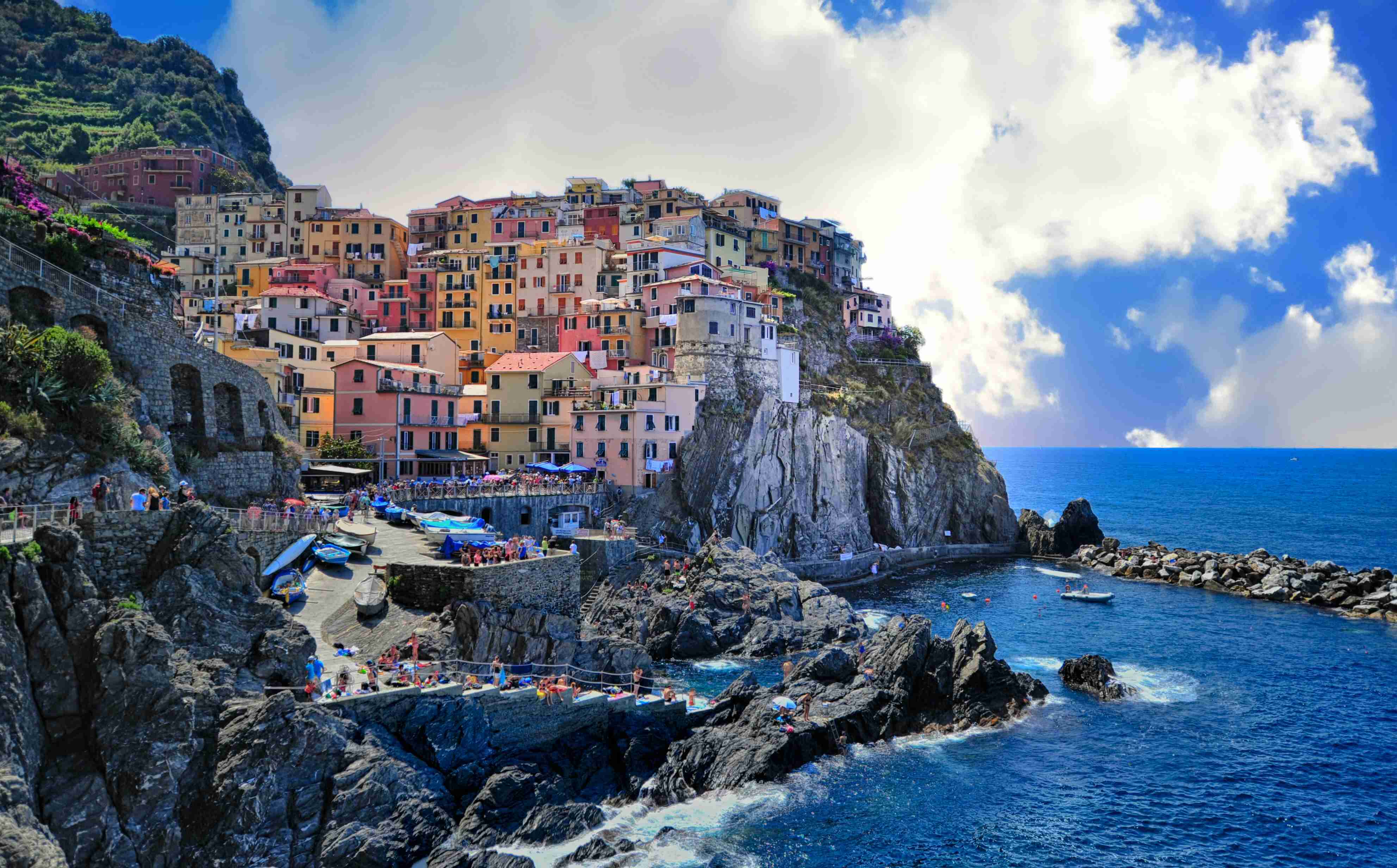 A colourful cliffside village above the sea — Tourism