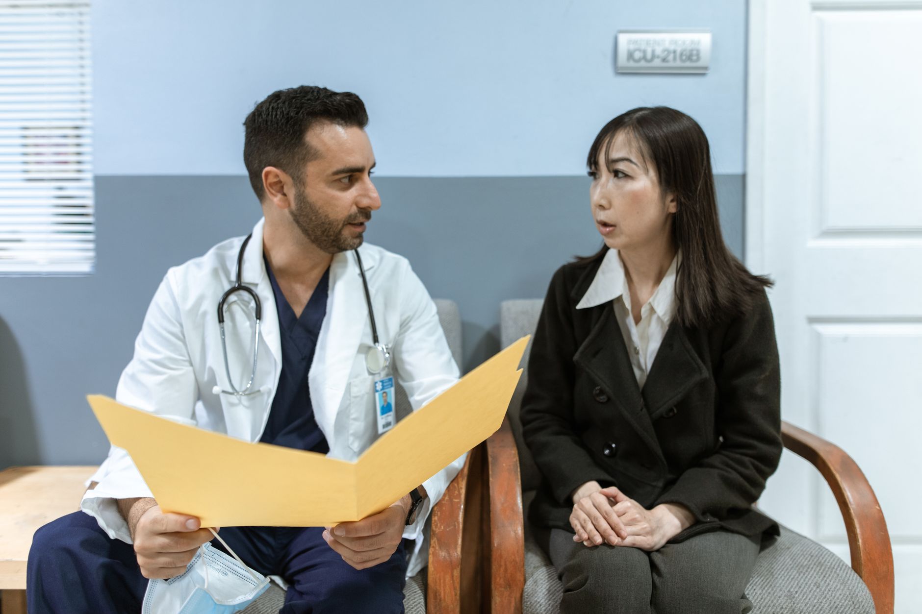 Healthcare professional consults patient in clinical setting. Medical discussion and diagnosis — Preventive Medicine