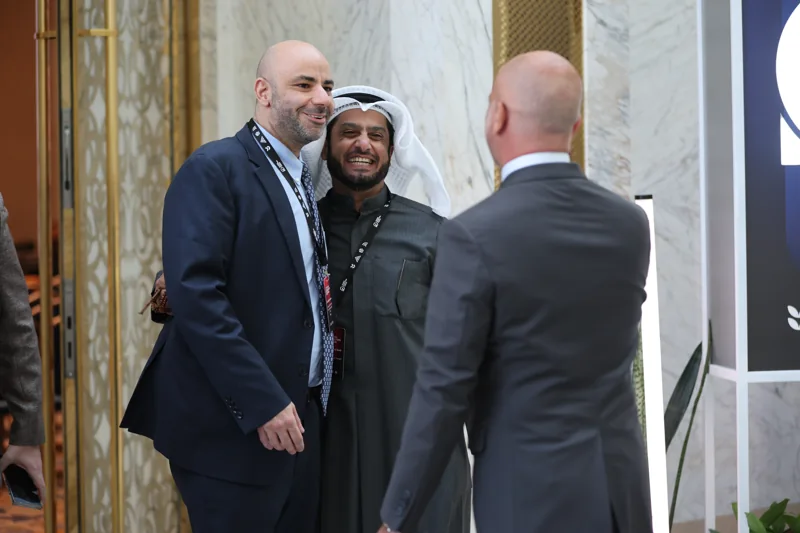 A conversation between delegates in the foyer at GIF Georgia 2025.
