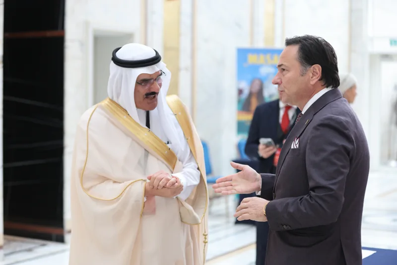 Two delegates in conversation in the foyer at GIF Georgia 2025.