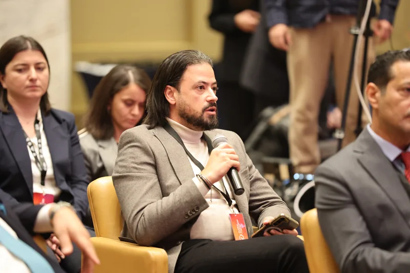 An audience question during a conference session at GIF Georgia 2025.