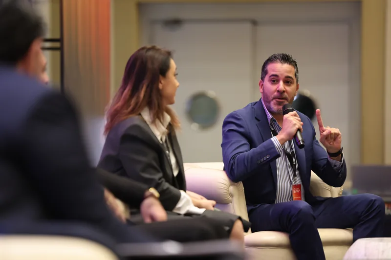Panellists in discussion on stage at GIF Georgia 2025.