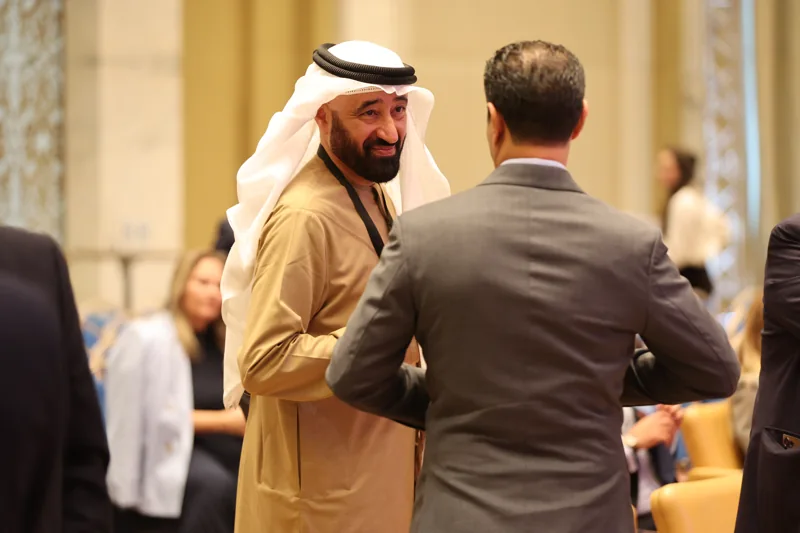 Delegates greeting each other by the conference seating at GIF Georgia 2025.